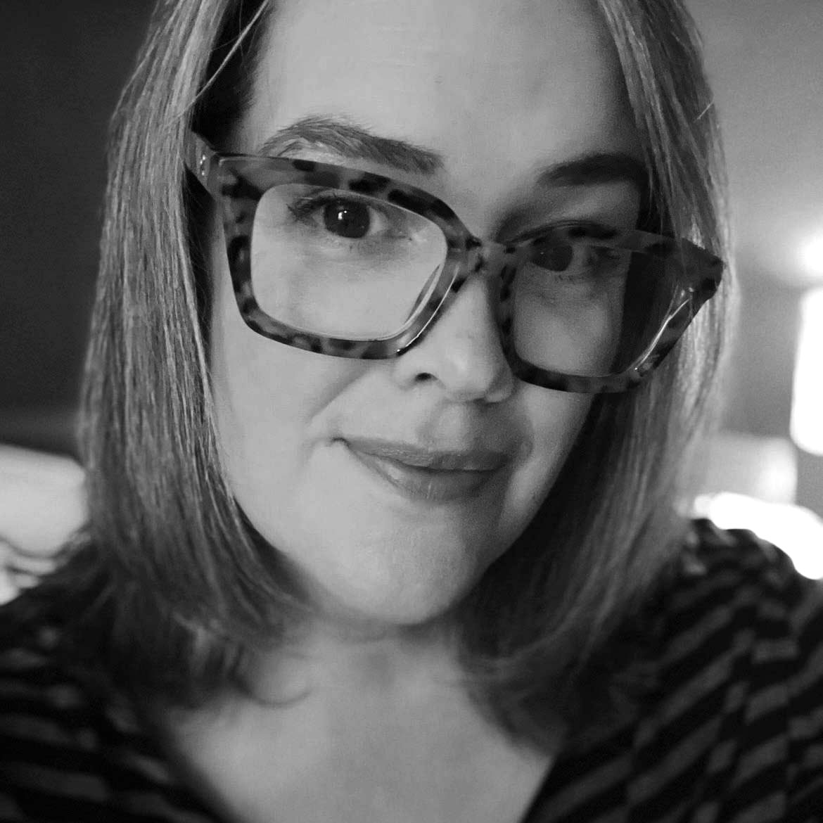 A portrait picture of Hannah Hill, of the Bound by Books podcast
